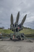 a group of missiles sitting on top of a field