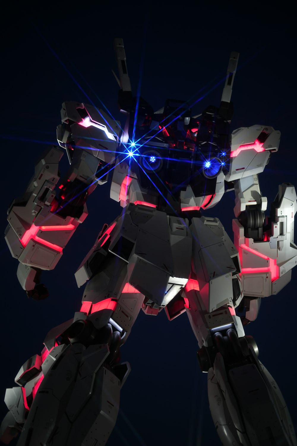 a futuristic robot with red and blue lights