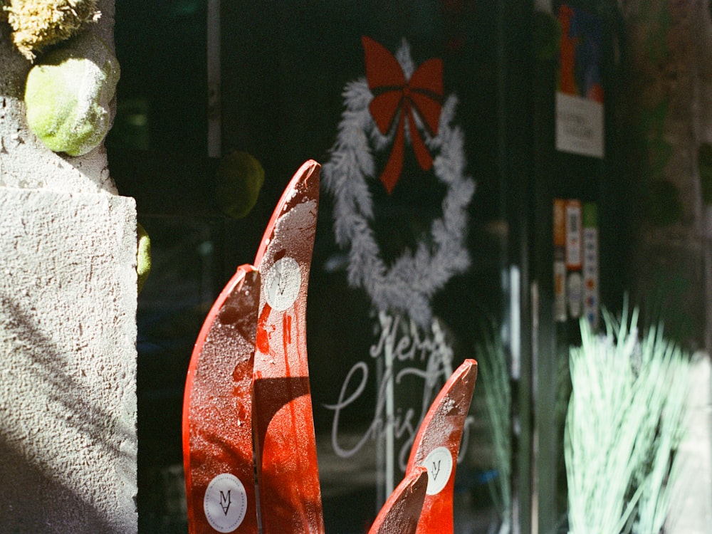 a pair of orange traffic cones sitting in front of a door