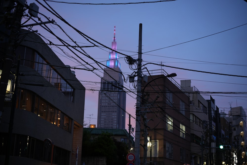 a view of a city at dusk from a street corner