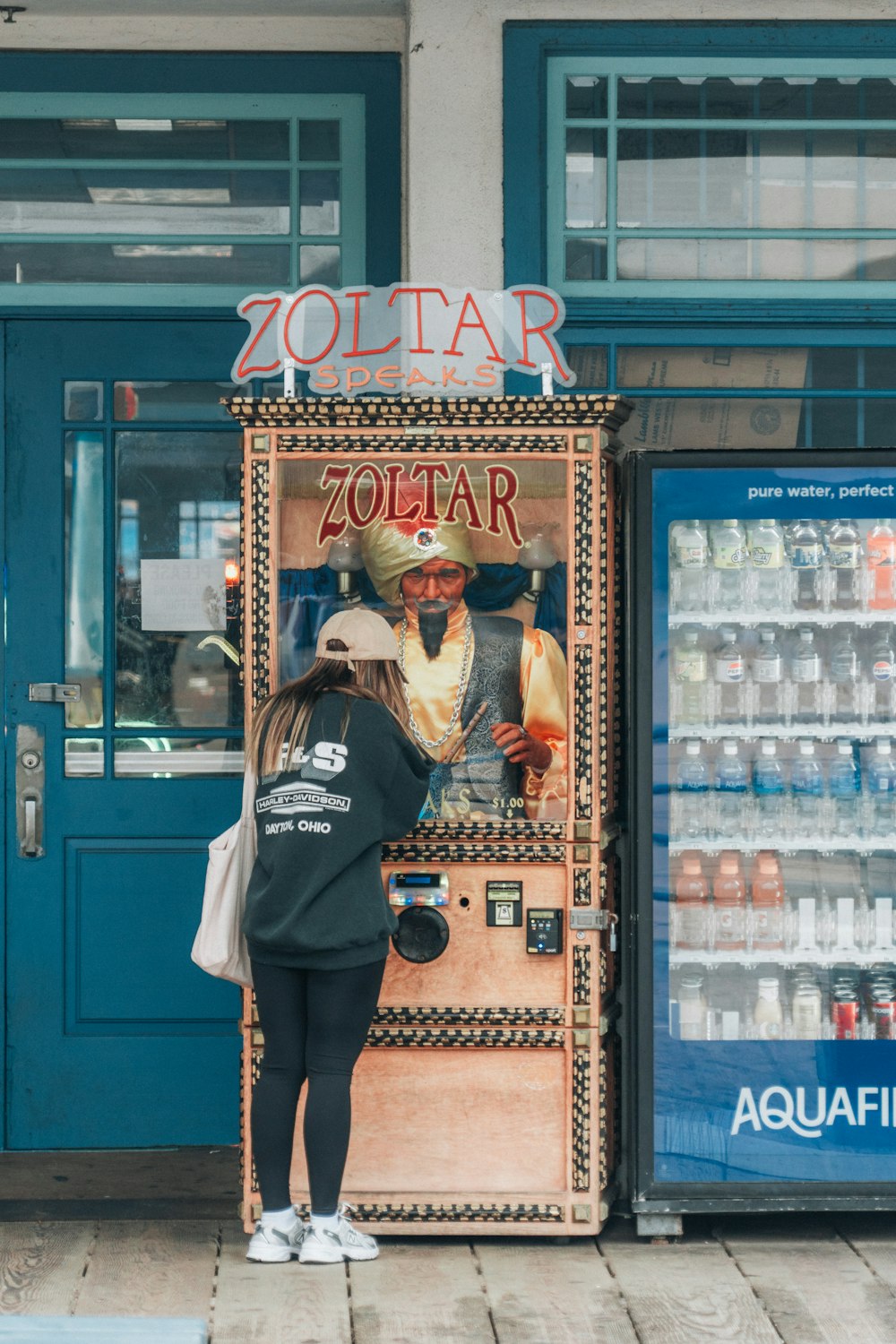 a woman standing in front of a vending machine