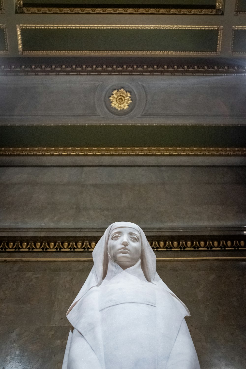 a statue of a woman with a veil on her head