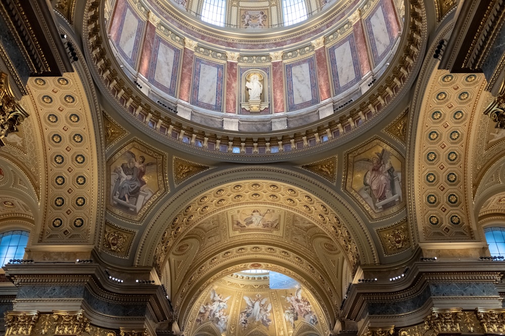the ceiling of a church with a large dome above it