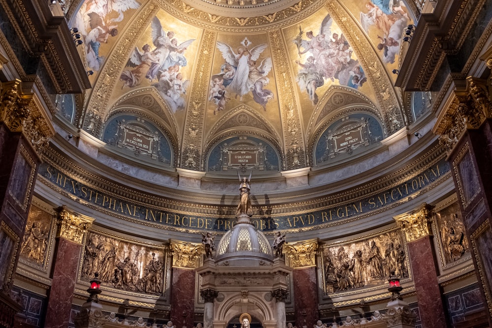 a church with a domed ceiling and paintings on the walls