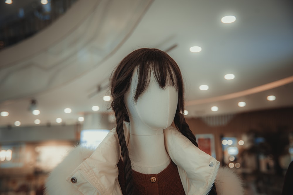 a mannequin with a long braid in a store