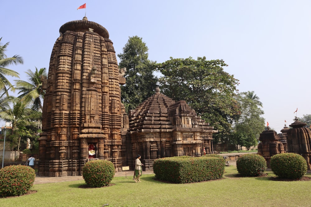 a large stone structure with a flag on top of it