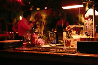 a bar with a bunch of bottles and glasses on it
