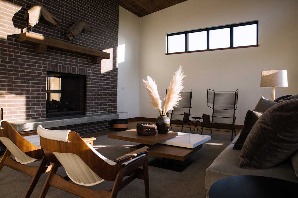 a living room filled with furniture and a fire place