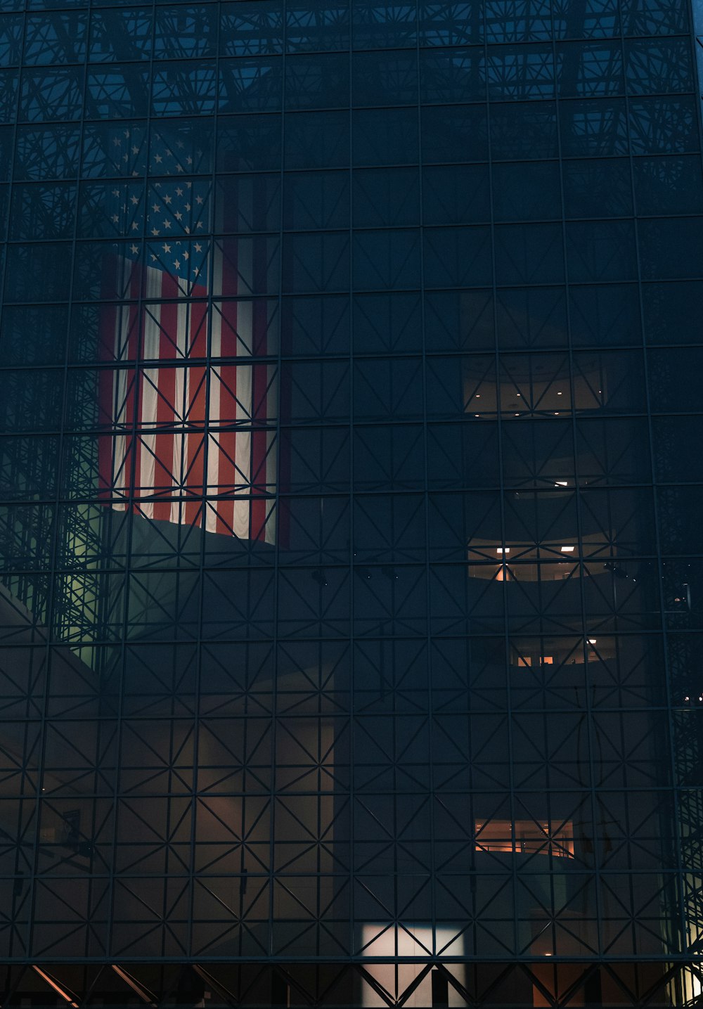 the reflection of a building in the glass of another building