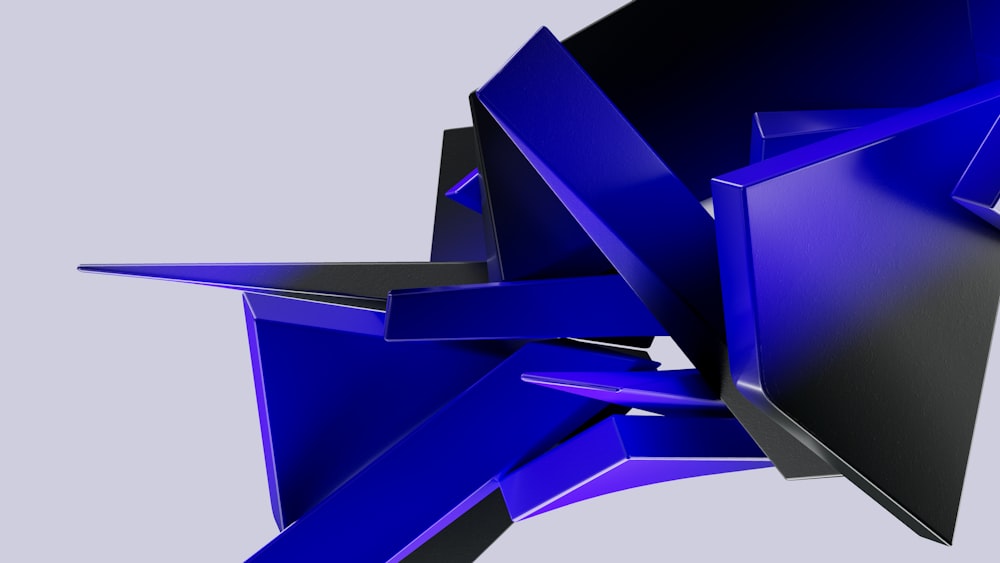 a blue abstract sculpture is shown against a gray background