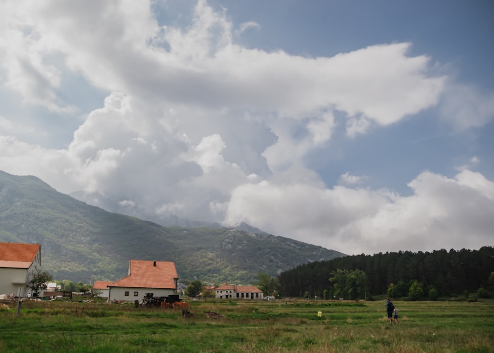 a man is flying a kite in a field