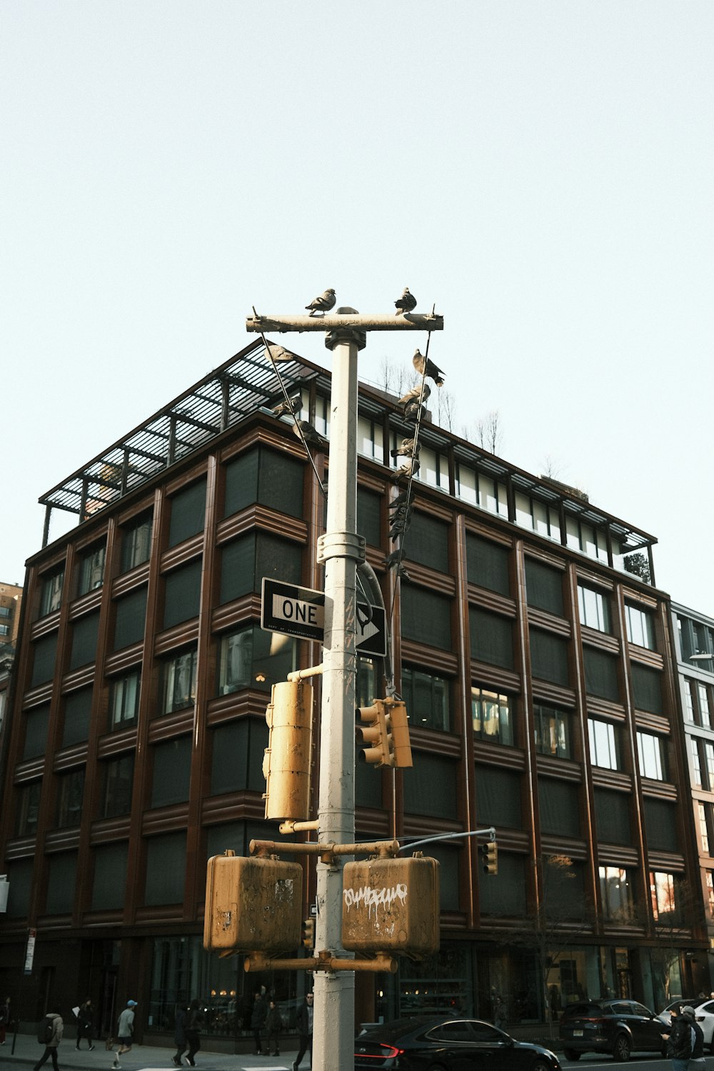 a traffic light sitting in front of a tall building