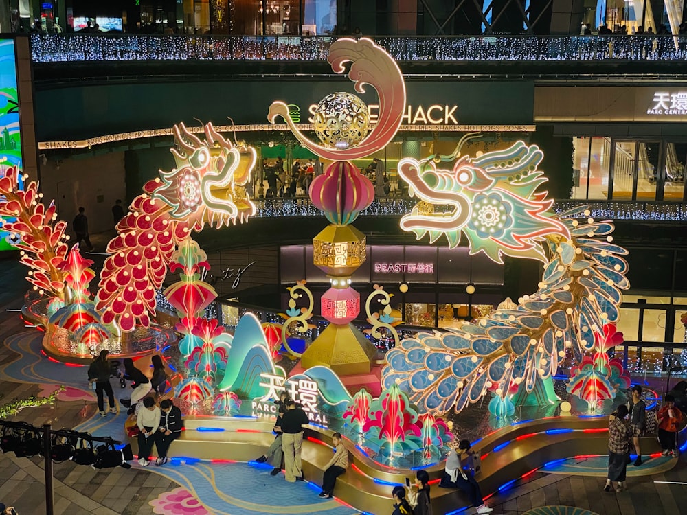 a group of people standing in front of a display