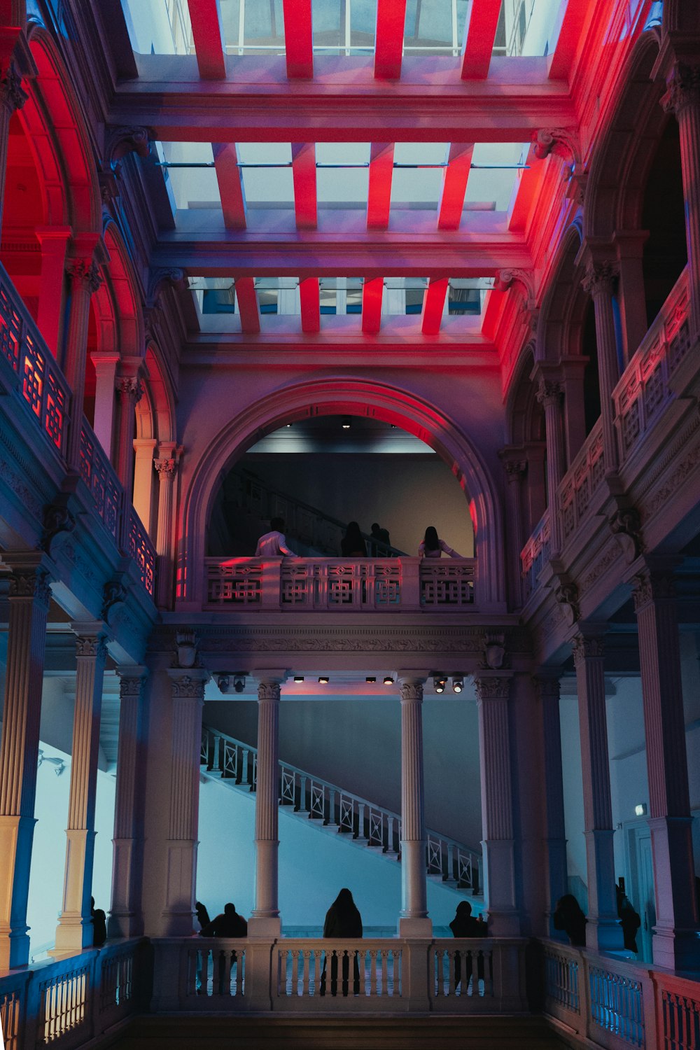 a large building with red and blue lights on the ceiling