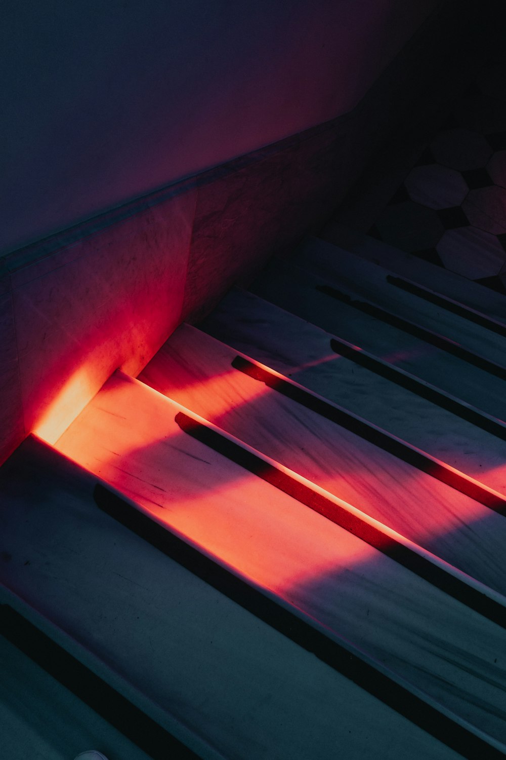 a close up of a piece of wood with a red light coming from it