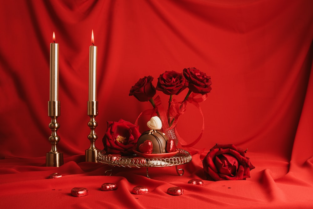 a red background with roses and candles
