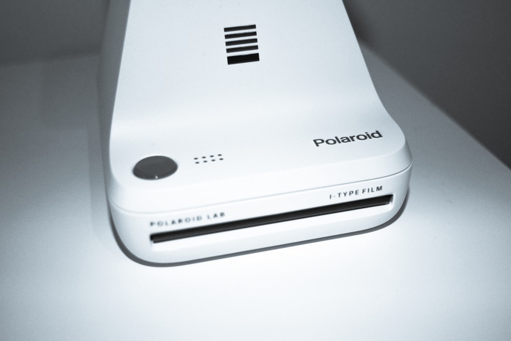 a white electronic device sitting on top of a table