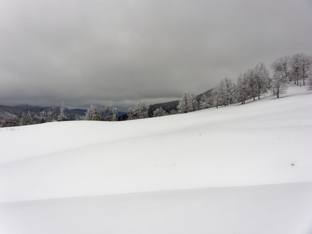 a person riding skis down a snow covered slope