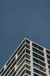 a tall building with a clock on the side of it