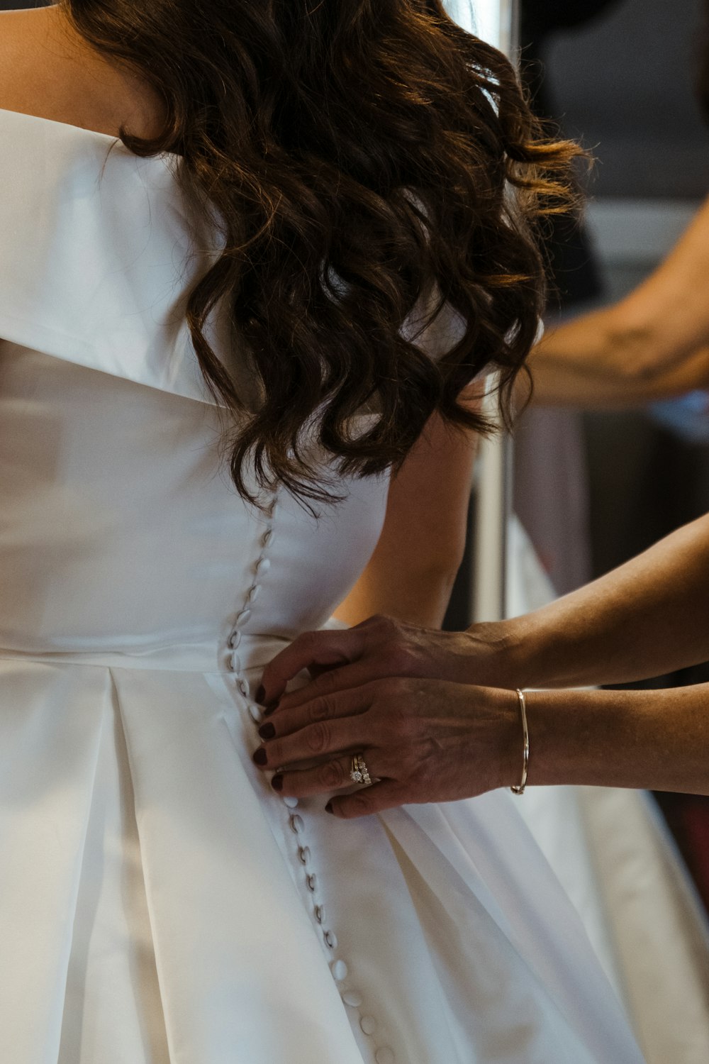 a close up of a person wearing a wedding dress