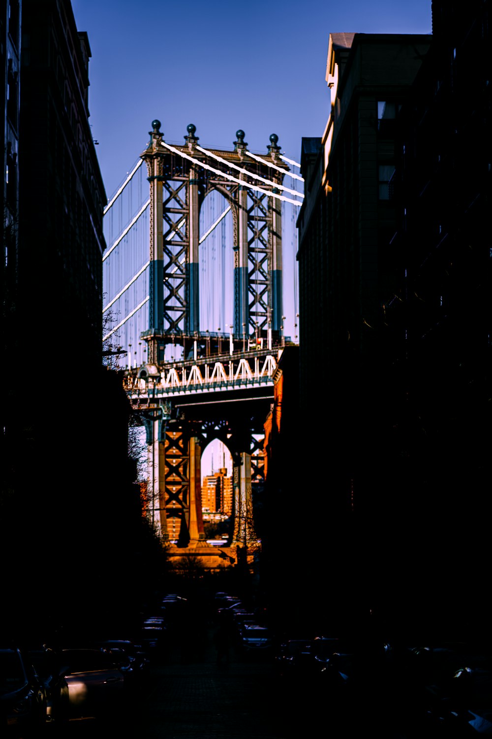 a view of a bridge from a narrow alley way