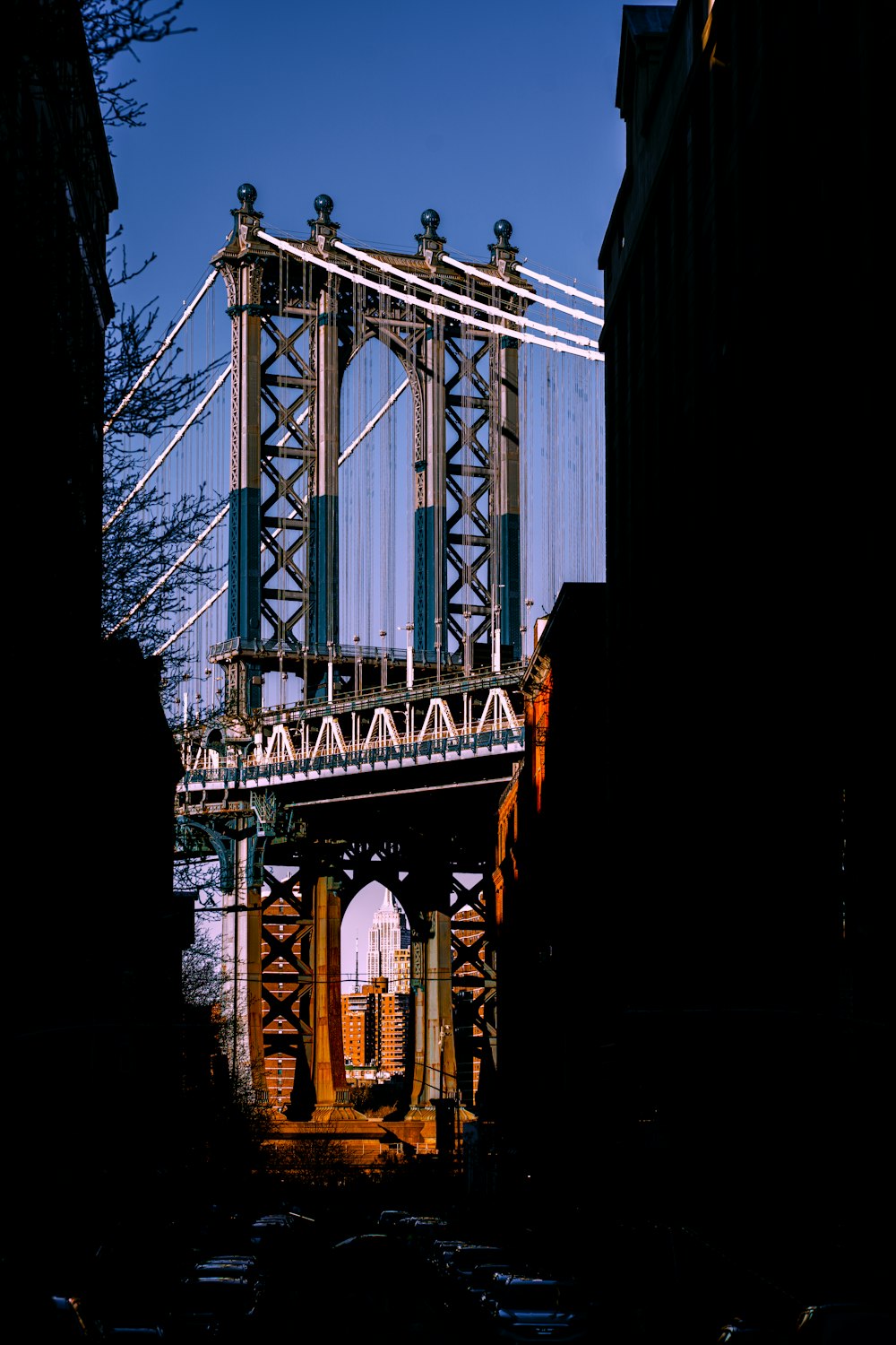 a view of a bridge from a narrow alley way