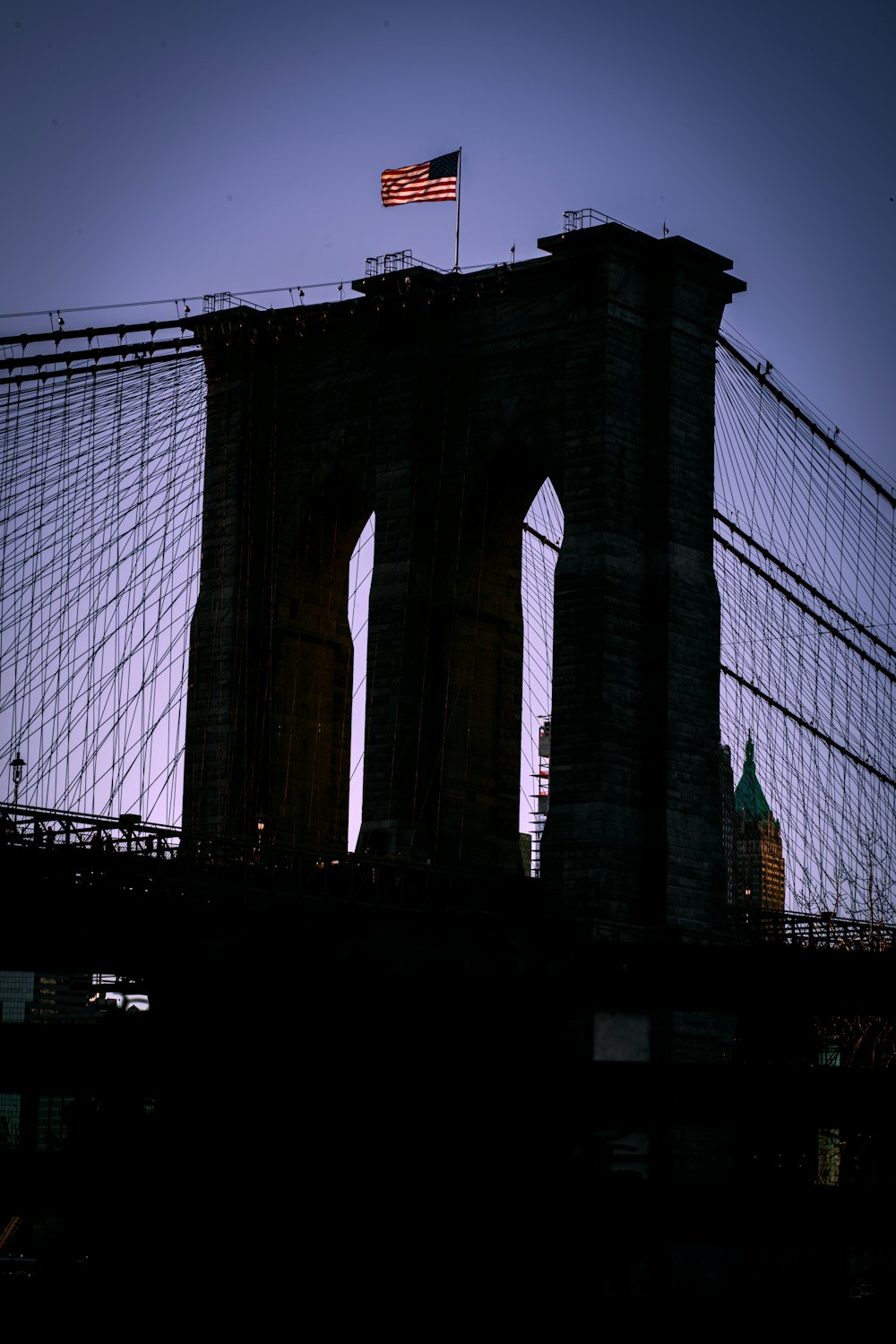 a view of a bridge with a flag on top of it