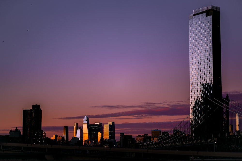 a view of a city skyline at sunset