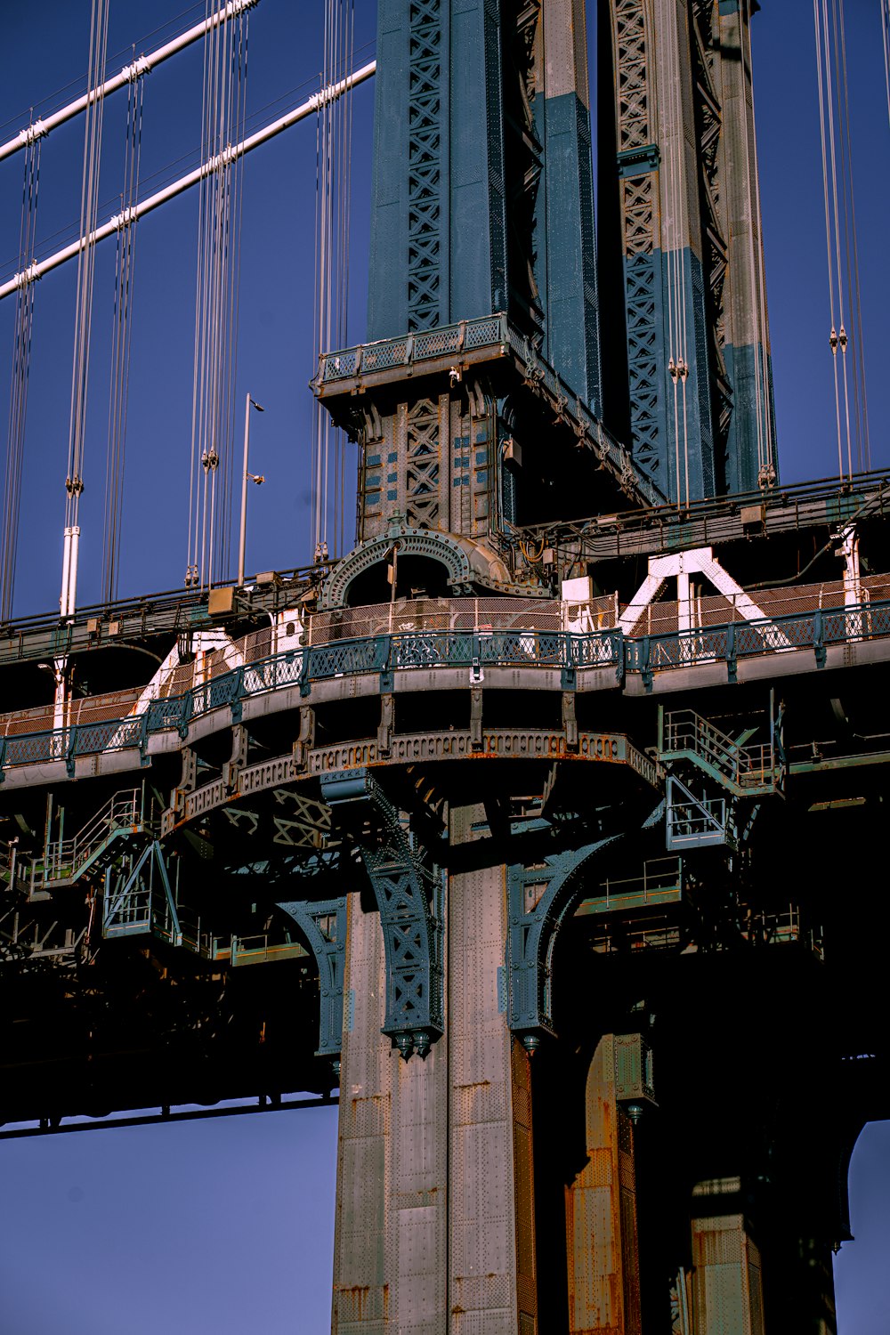 a very tall bridge with a very tall clock tower