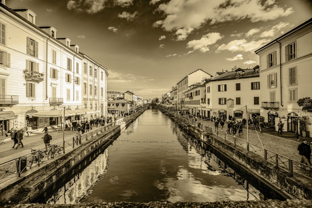 a river running through a city next to tall buildings