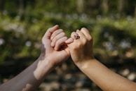 a couple of people that are holding hands