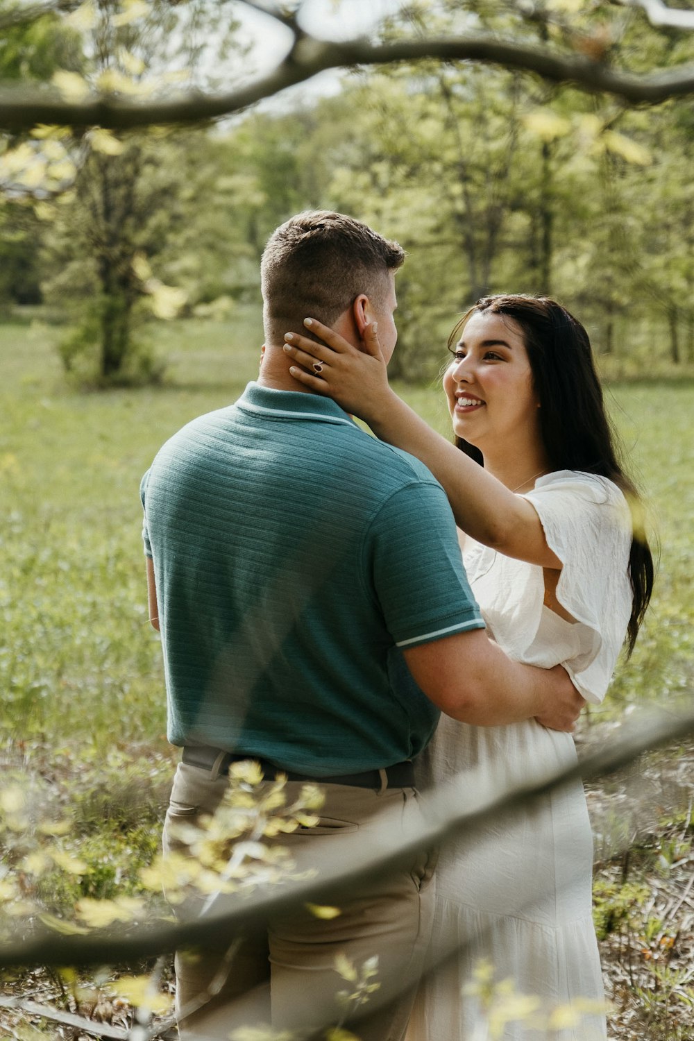 a man and a woman standing in a field