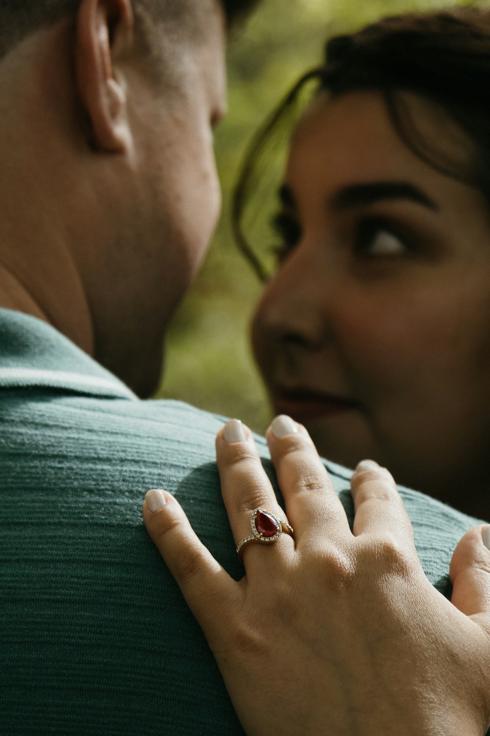 a close up of a person with a ring on their finger