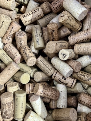 a bunch of wine corks are piled on top of each other