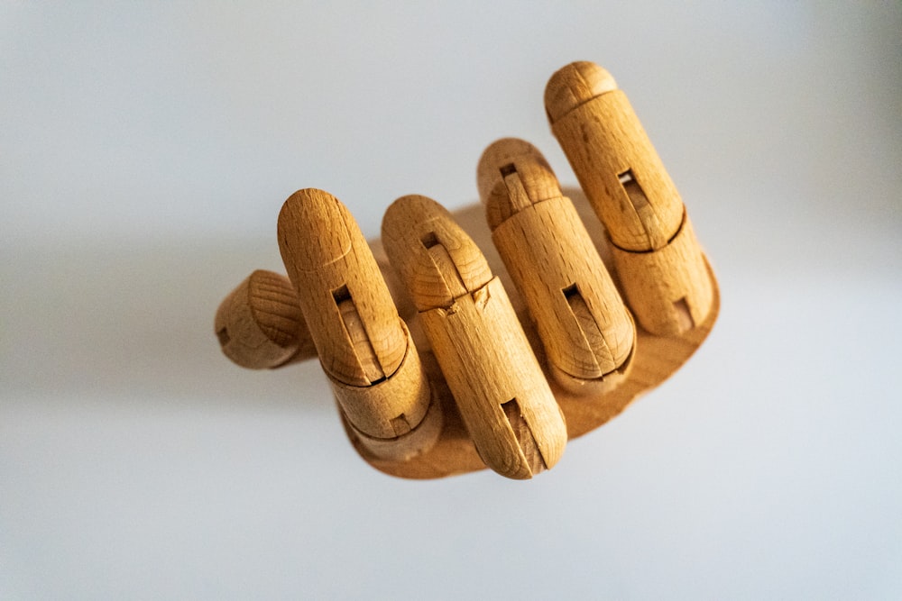 a group of wooden pegs with faces on them