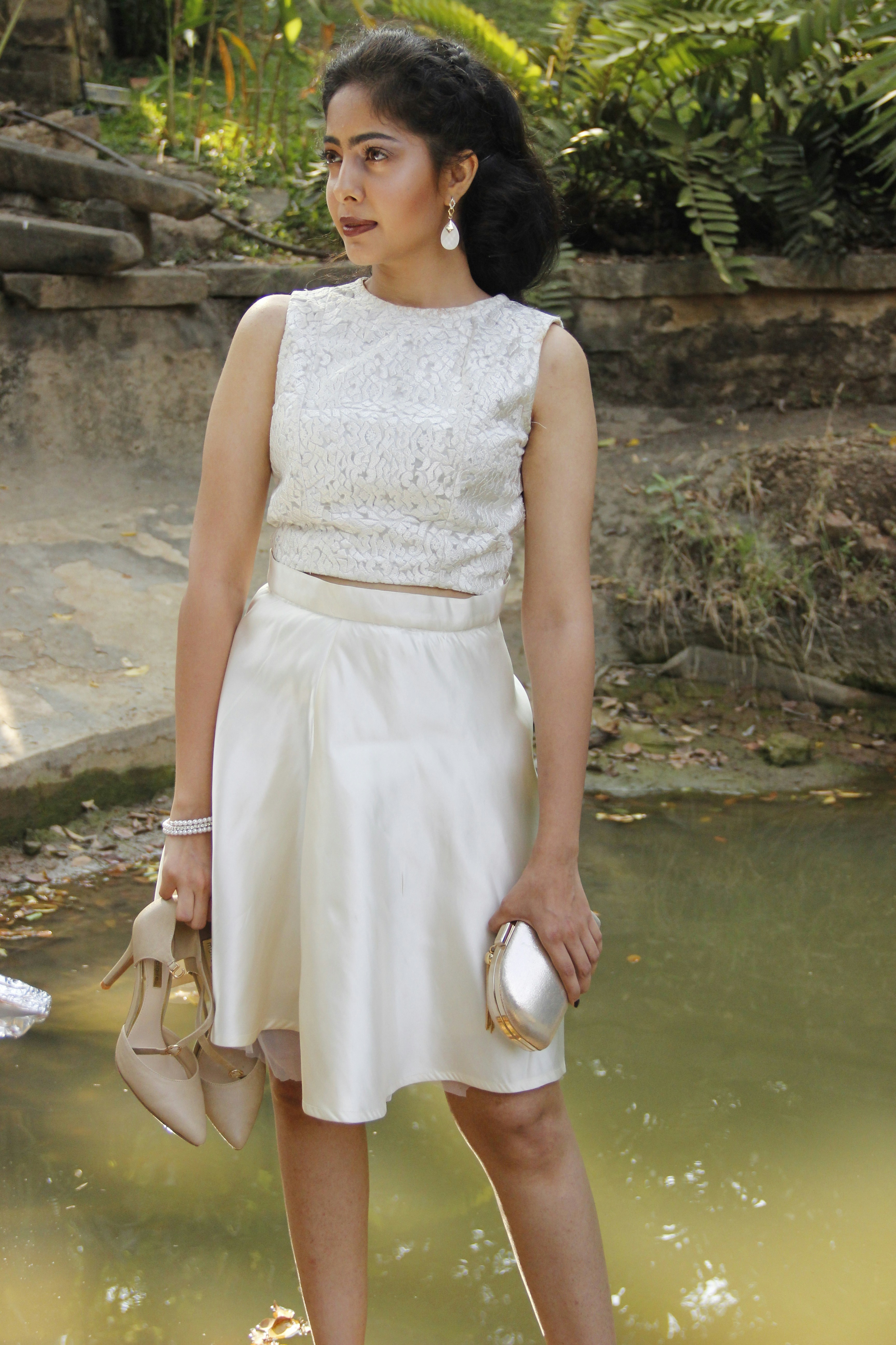 A woman in a white dress standing in front of a pond photo – Free Girl ...