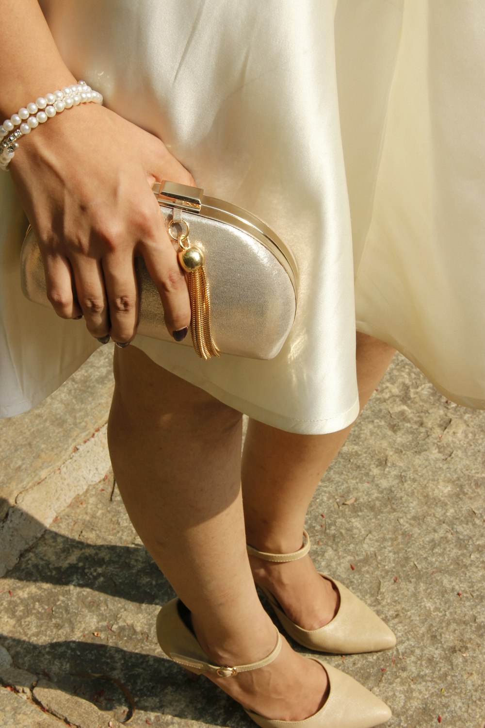 a close up of a person holding a purse