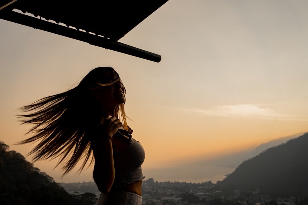 a woman with her hair blowing in the wind