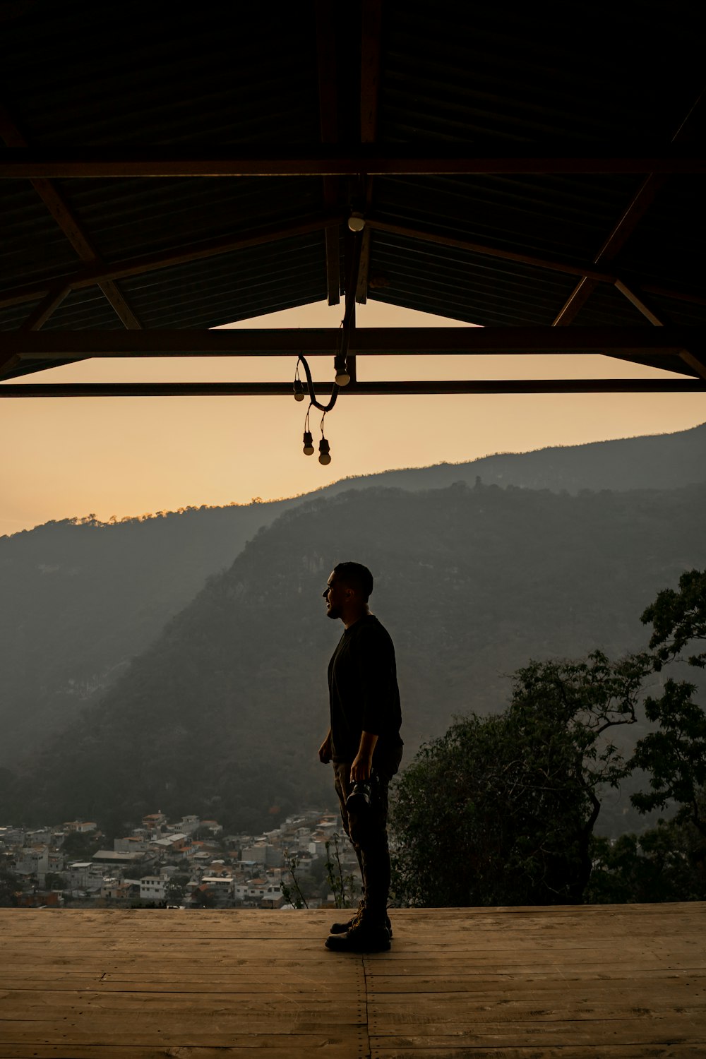 a man standing on top of a wooden platform