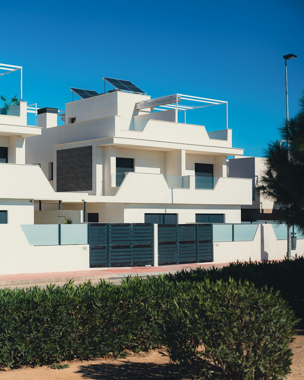 a large white building with balconies on top of it