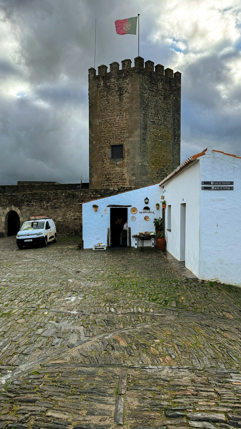 a white van parked in front of a castle