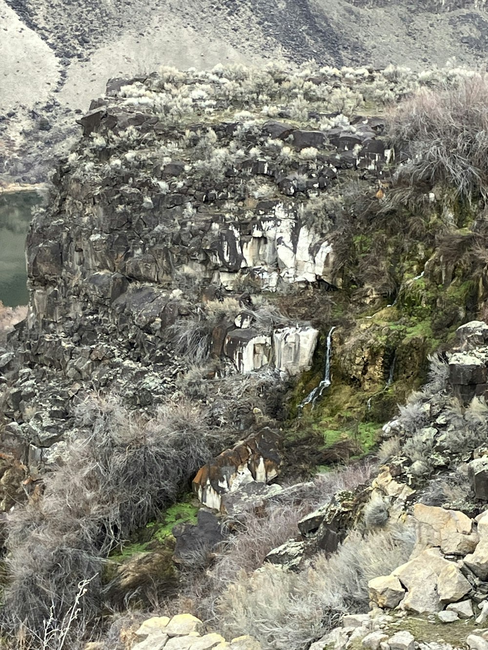 a mountain with a waterfall in the middle of it