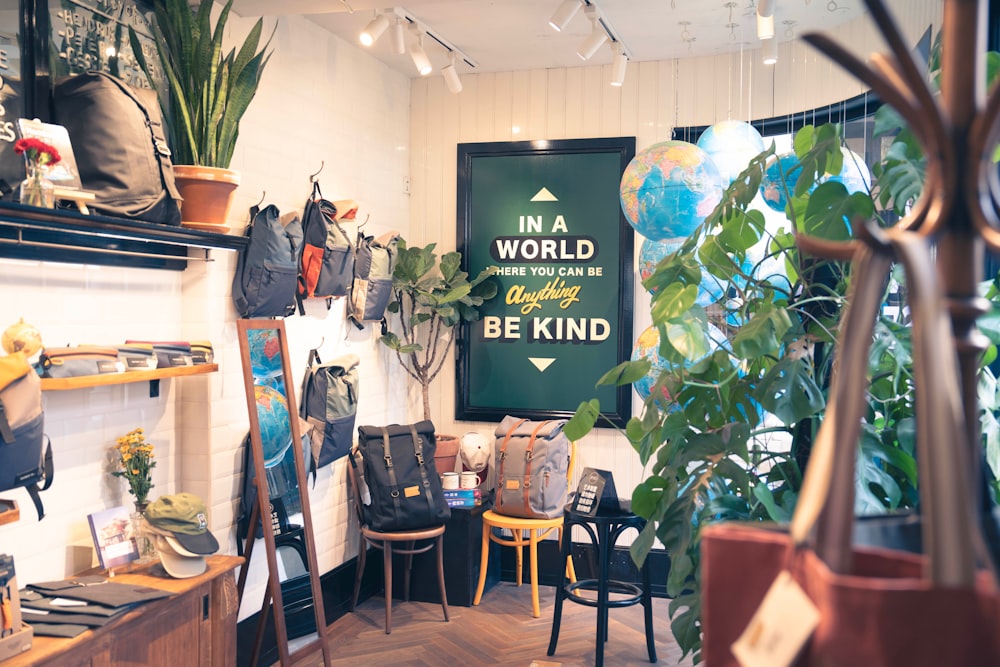 a room with a sign that says in a world where you can be kind of