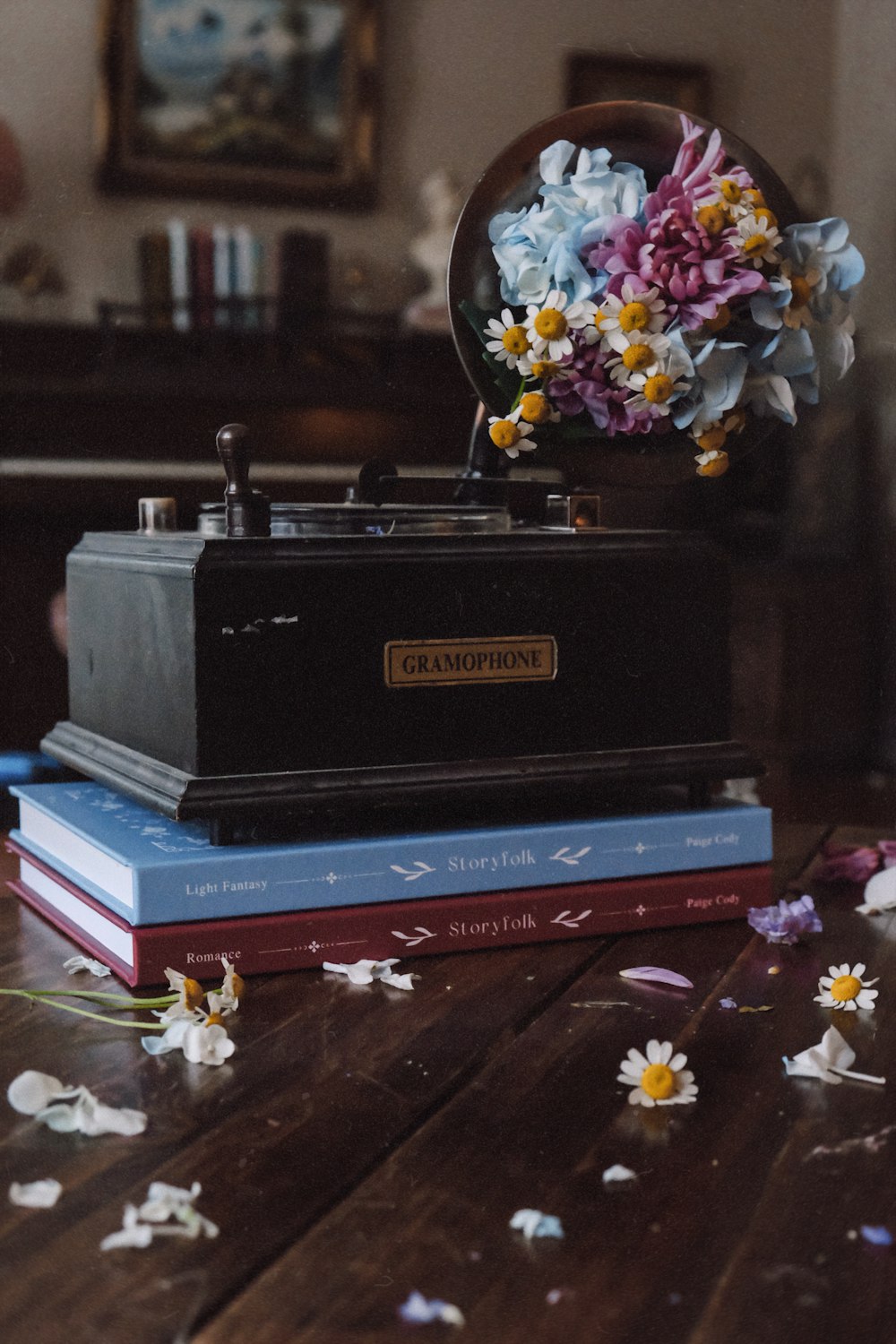 a stack of books sitting on top of a wooden table