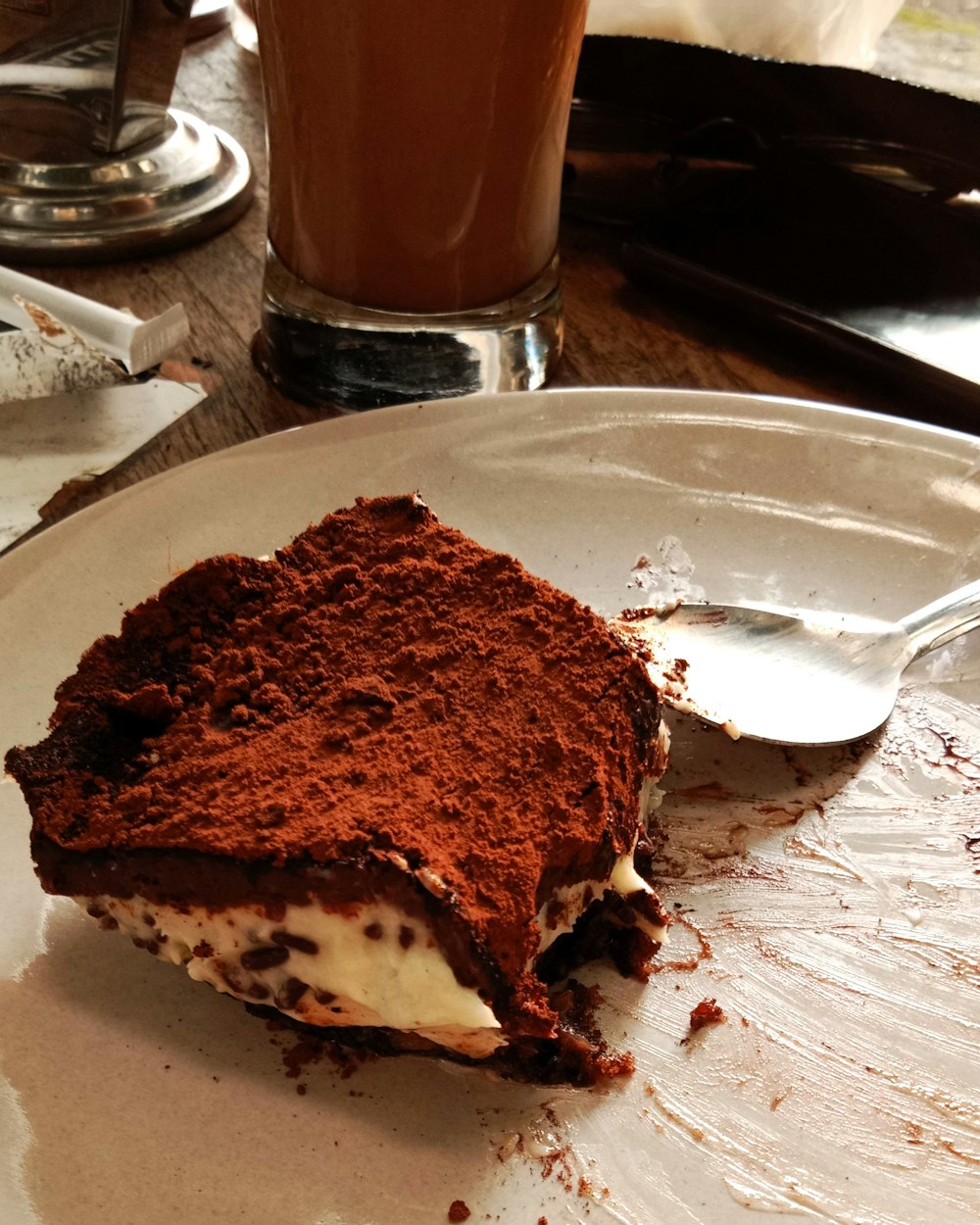 a piece of cake on a plate with a spoon