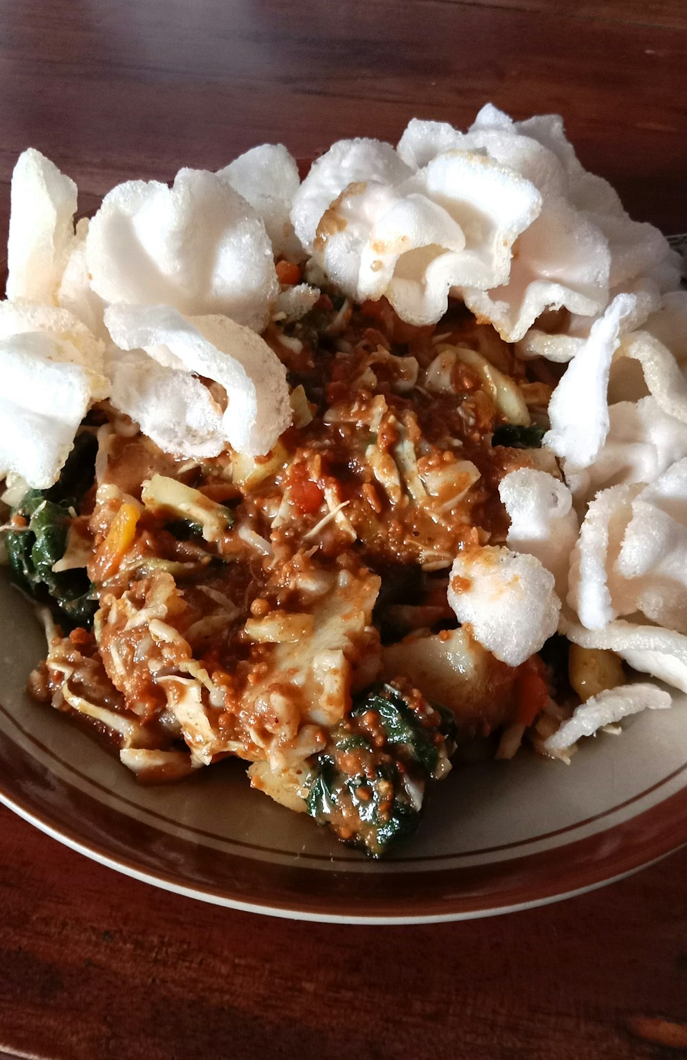 a plate of food on a wooden table