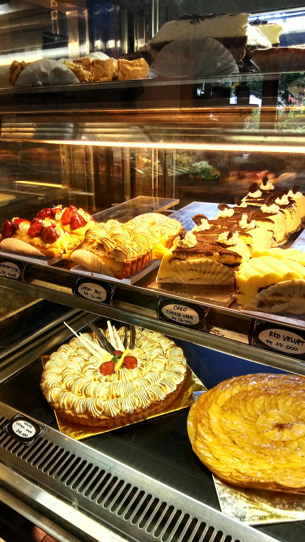 a display case filled with different types of pies