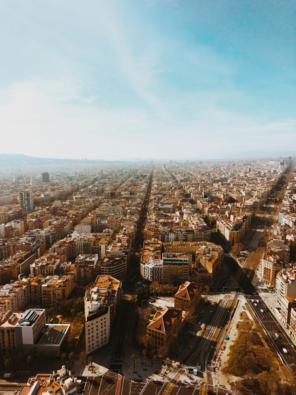 an aerial view of a city with tall buildings