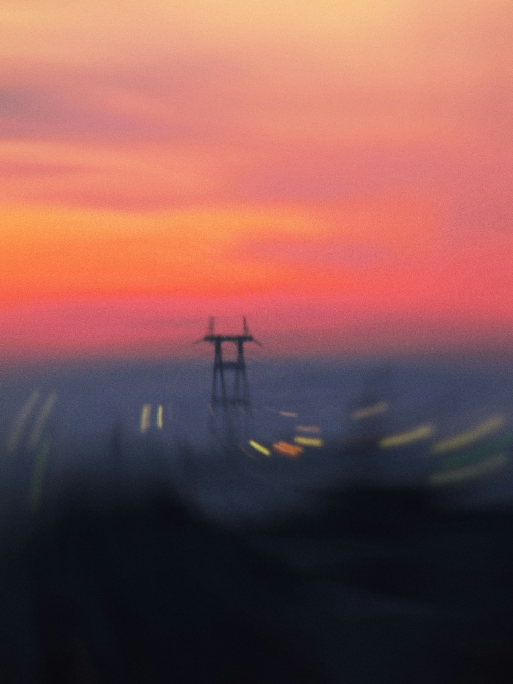 a blurry photo of a windmill in the distance