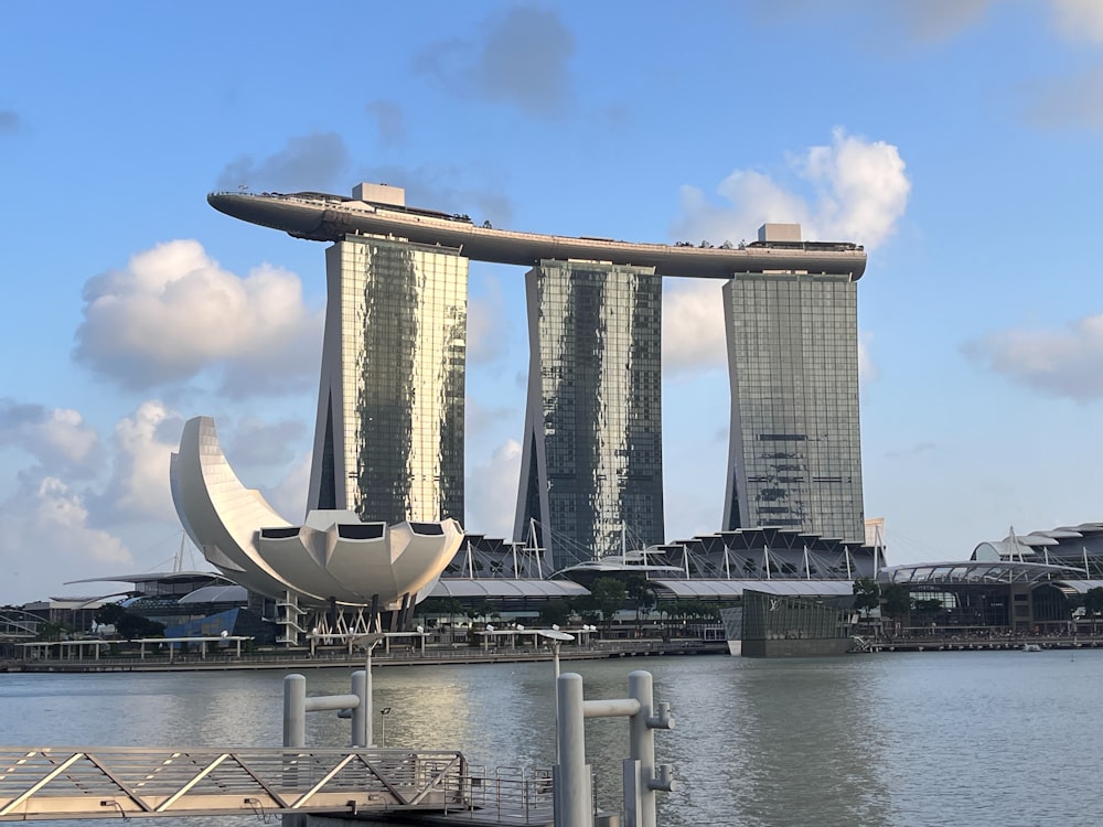 a body of water with a bunch of tall buildings in the background